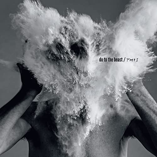 Afghan Whigs album cover: a person obscured by a white powder explosion.