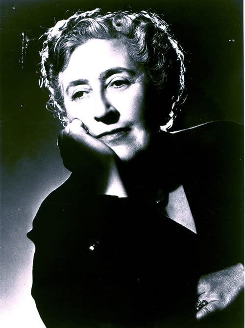 Black and white portrait of Agatha Christie, author of "Evil Under the Sun".