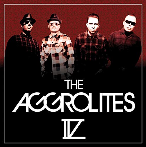 The Aggrolites band portrait with four men in hats and plaid shirts.