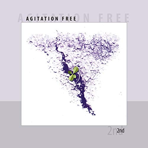 Album cover: abstract purple design with a central four-leaf clover.