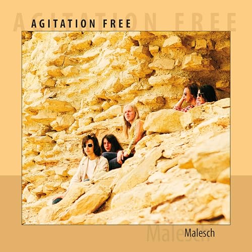 CD cover: four people sit amongst rocky, yellow desert terrain.