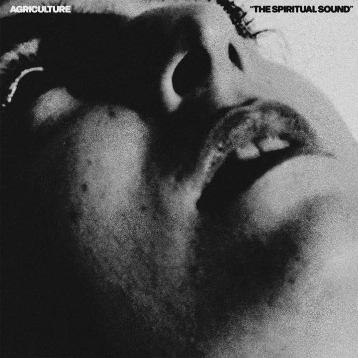 Black and white CD cover featuring a close-up of a person’s face.