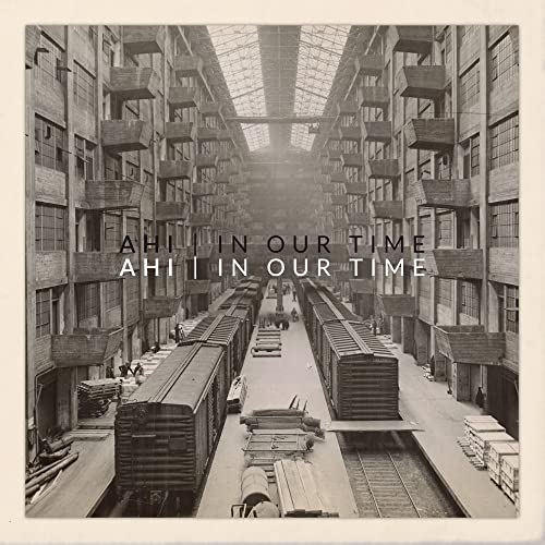 Black and white photo of a train yard with album title overlay.