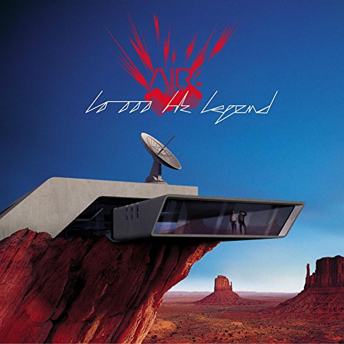 Album cover for Air’s “10 000 Hz Legend” featuring a futuristic building and desert landscape.