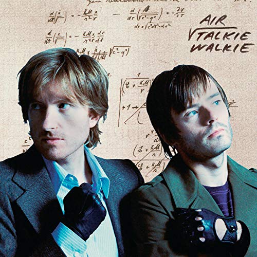 Vinyl record with cover featuring two men and handwritten notes.