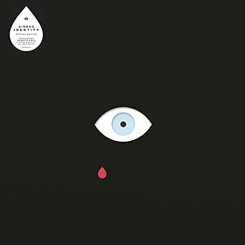 Black album cover with a white eye and a red teardrop.
