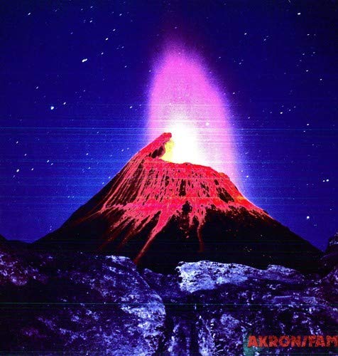 A glowing volcano erupts under a starry night sky with purple and blue tones.