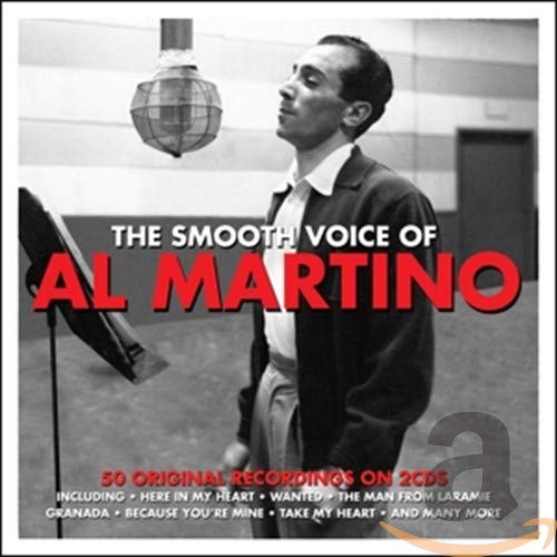 Black and white photo of Al Martino singing into a vintage studio microphone.