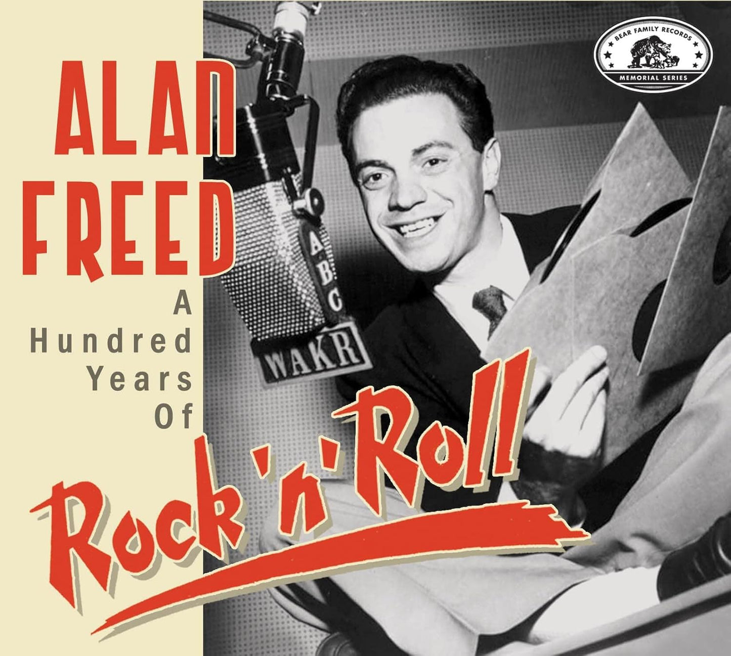 Black and white photo of Alan Freed at a microphone, CD cover art.