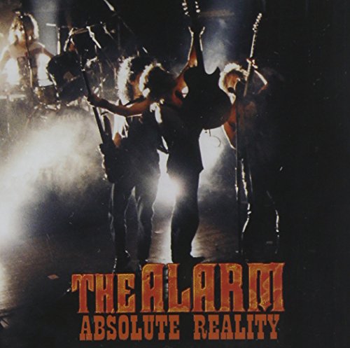 Band performing on stage with bright lights, album cover for The Alarm.