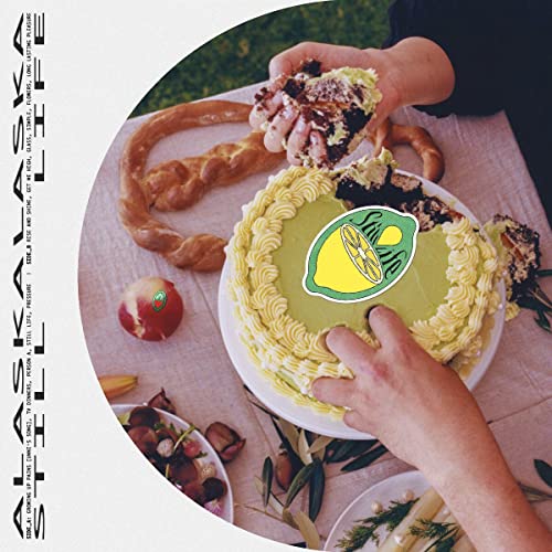 Vinyl album cover: a still life with cakes, fruit, and hands.
