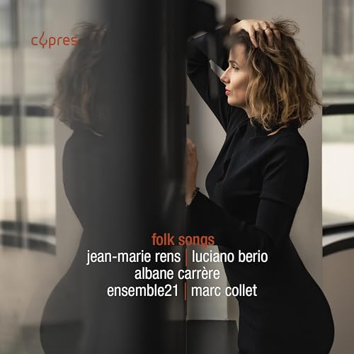 CD cover featuring a woman in black with "folk songs" text.
