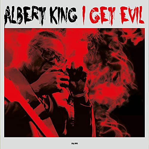Albert King album cover: portrait with red background and smoke effects.