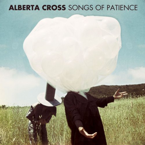 Album cover: person in black suit with large white cloud head.