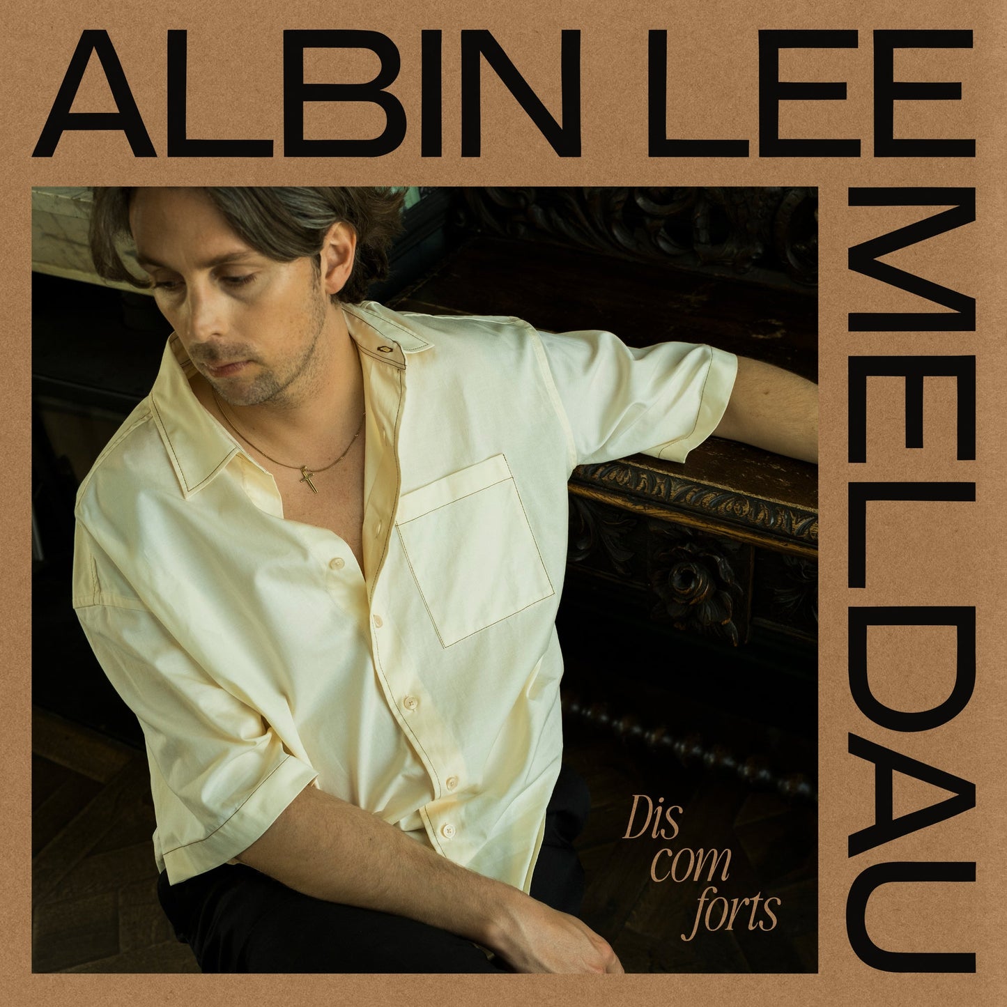 Album cover for Albin Lee Meldau’s “Discomforts” featuring a portrait of the artist.