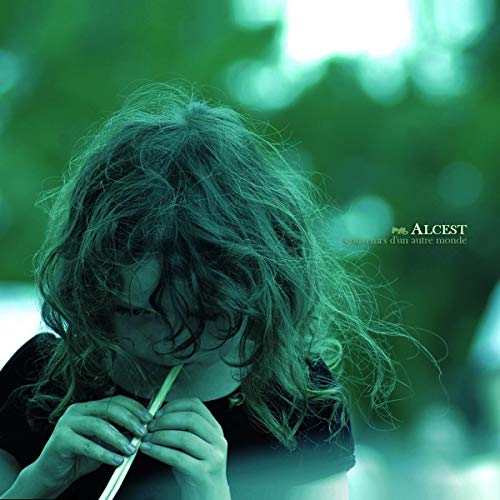 Album cover: person with long hair holding a flute, green tones.
