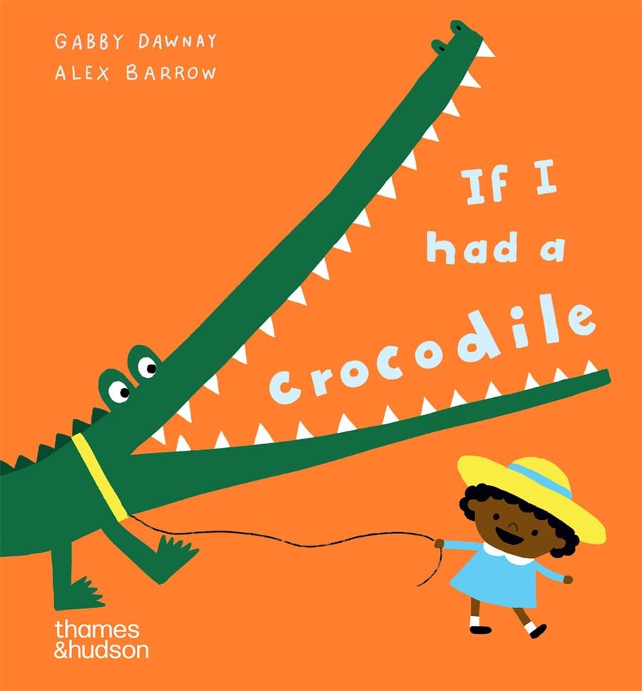 A young child in a yellow hat walks a green crocodile on a leash.
