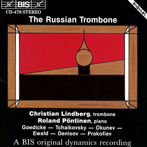 "Album cover with abstract red, black, and brown design on a black background."