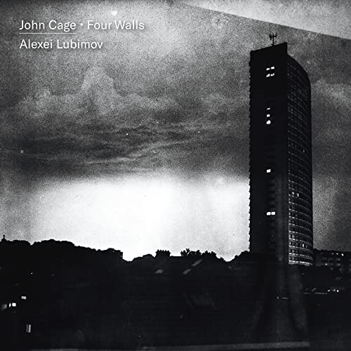 Black and white CD cover featuring a tall building against a cloudy sky.