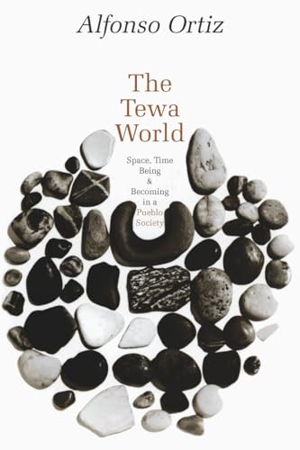 Book cover with title "The Tewa World: Space" and scattered stones.