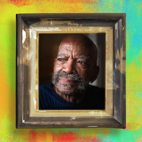 A portrait of an elderly Black man with a mustache inside a vintage frame.