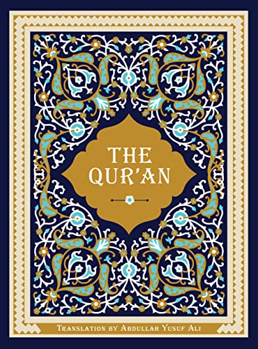 Ornate cover of "The Qur'an" with gold text on a blue and gold pattern.