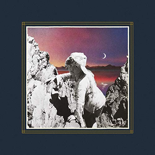 Album cover featuring a hooded figure amidst a rocky, sunset landscape.