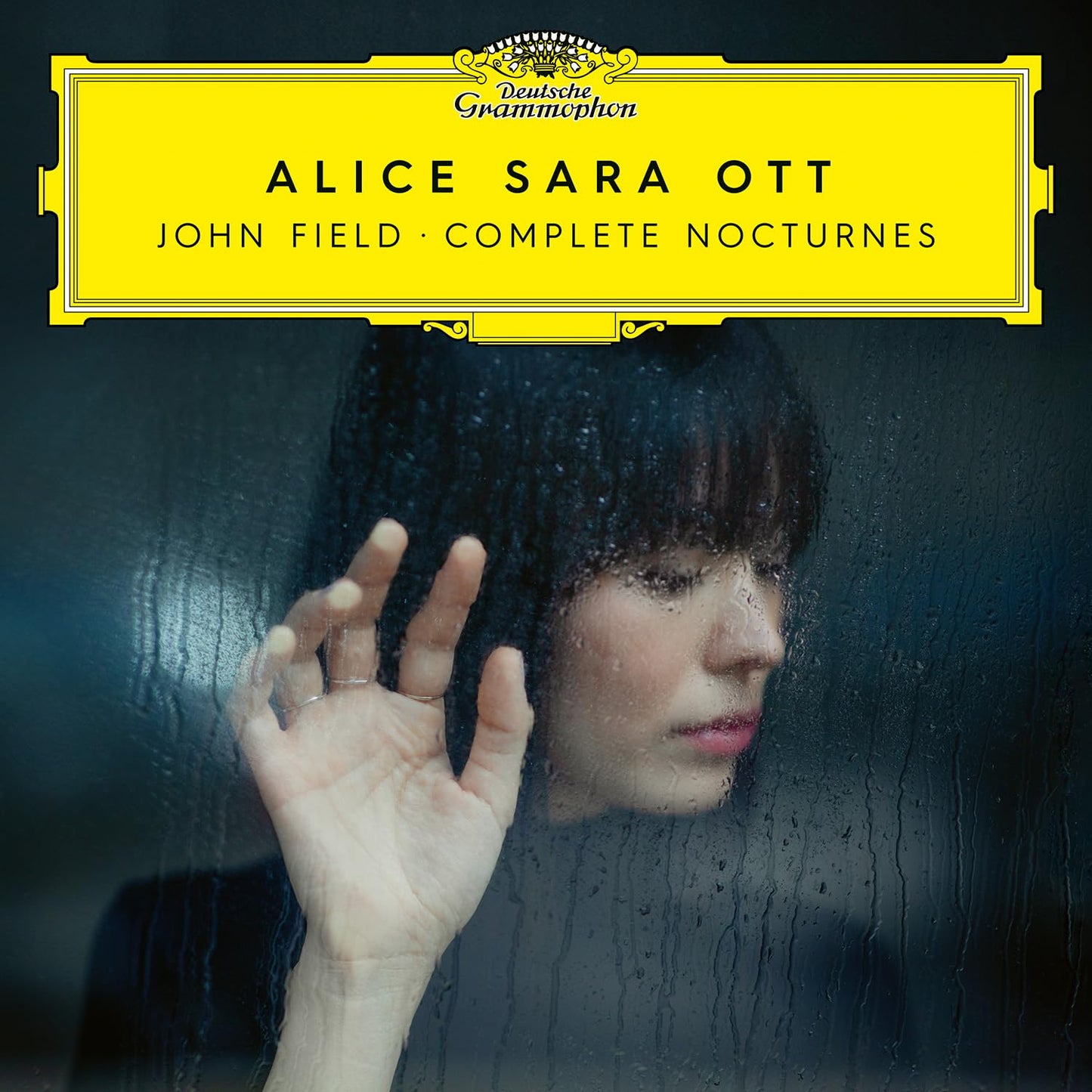 Album cover for Alice Sara Ott’s “Complete Nocturnes” with a rain-streaked portrait.