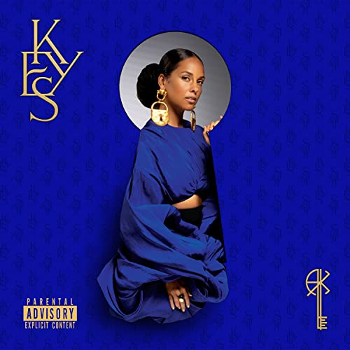 Alicia Keys wearing a blue dress against a blue patterned background with gold accents.