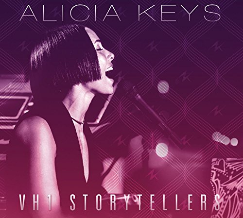 Alicia Keys singing into a microphone on a purple, patterned background.