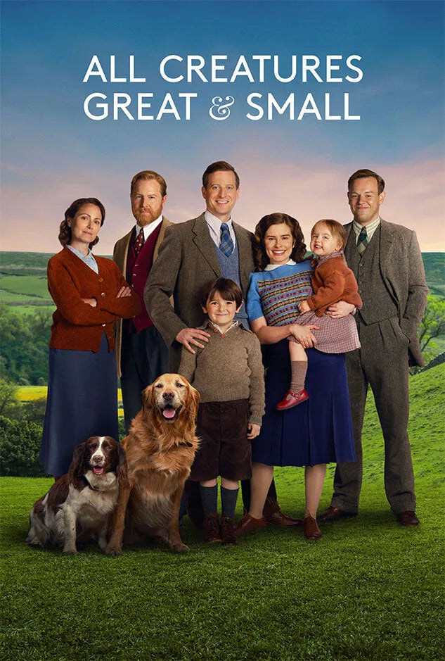 All Creatures Great & Small" cast portrait with two dogs on grass.