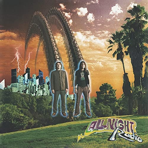 Album cover featuring two people in front of a city and palm trees.