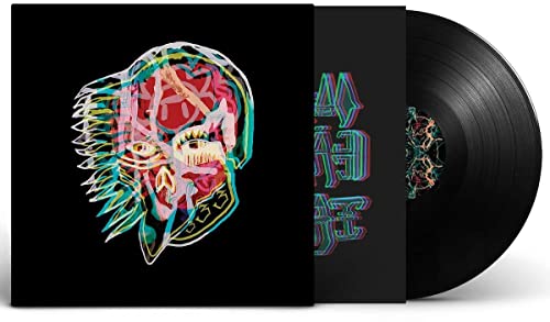 Vinyl record with cover art featuring a distorted, colorful face.