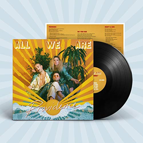 Vinyl record and album cover featuring three people against a yellow sunburst background.