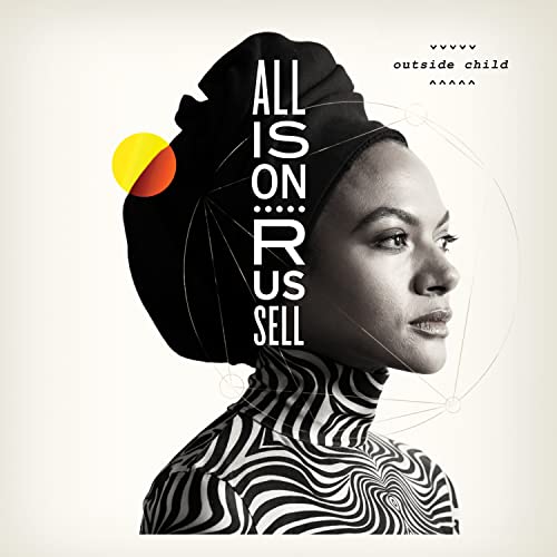 Black and white portrait of Allison Russell wearing a headwrap and patterned turtleneck shirt.
