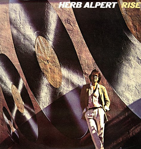Album cover for Herb Alpert’s “Rise” featuring a man and abstract shapes.