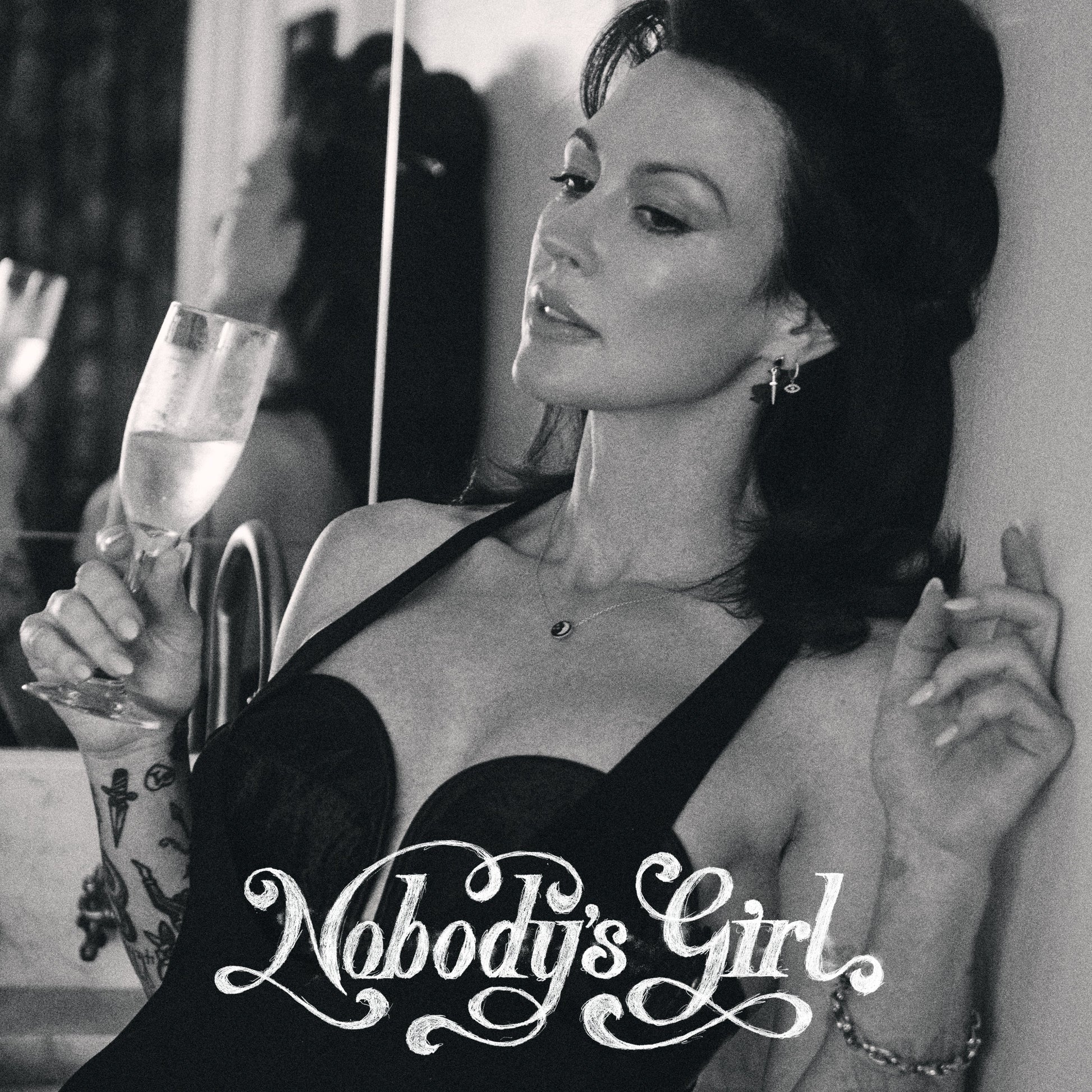 Black and white portrait of Amanda Shires holding a drink, album title below.