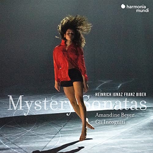 CD cover featuring a dancer in red against a dark, abstract background.