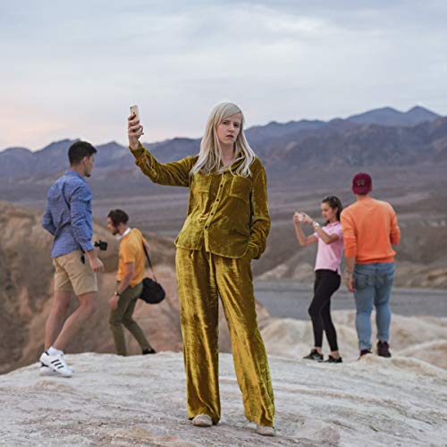 "Album cover for 'European Heartbreak' by Amber Arcades, featuring a blonde woman in gold."