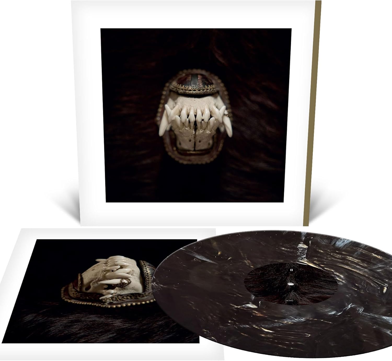 Vinyl record and cover art featuring a textured, animalistic mask.