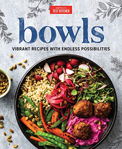 Cookbook cover featuring a colorful grain bowl with vegetables and seeds.