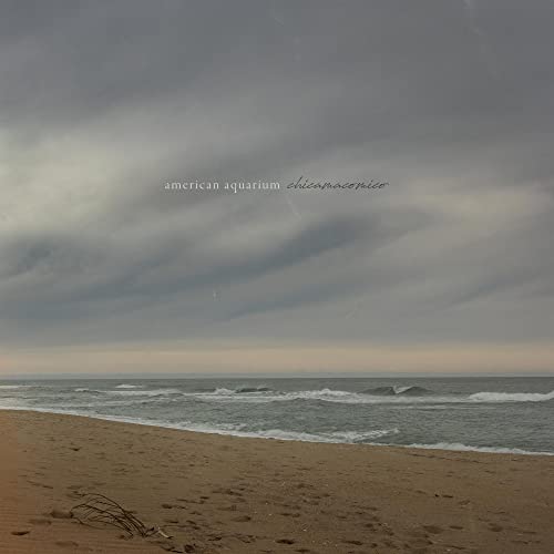 Album cover: beach scene with cloudy sky and text “american aquarium chicamacomico”.
