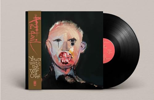 Vinyl record with painted cover featuring a distressed clown face.