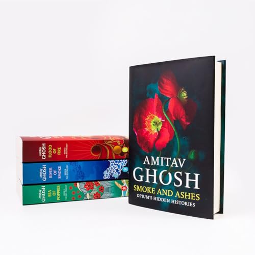 A stack of three books next to a vertical book titled Smoke and Ashes.