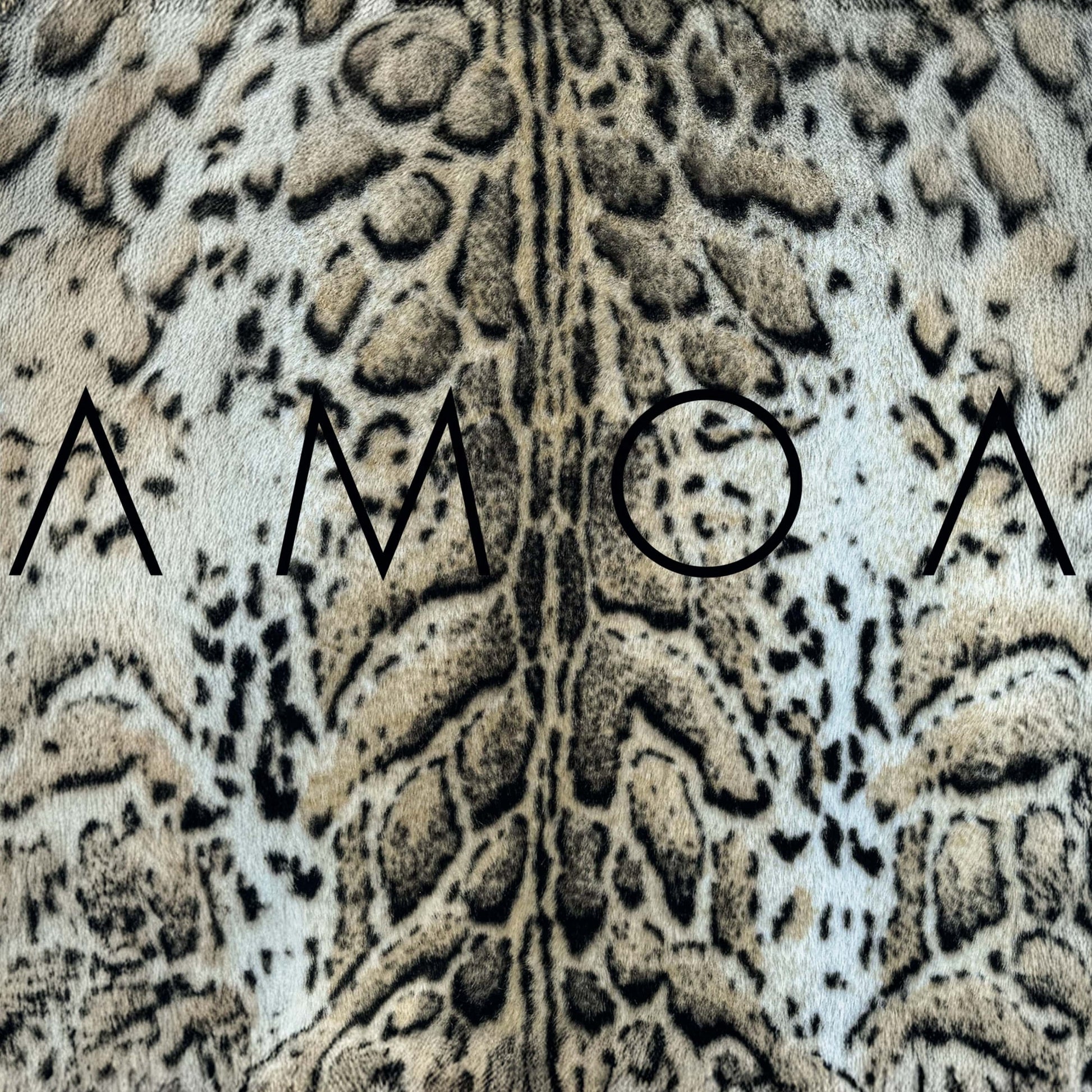 Vinyl record cover with a leopard print background and black text.