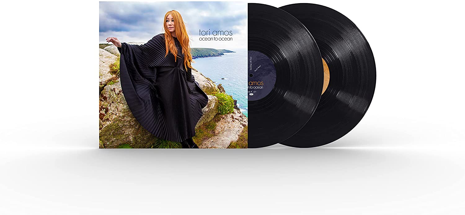 Tori Amos album cover: woman in black dress by the ocean.