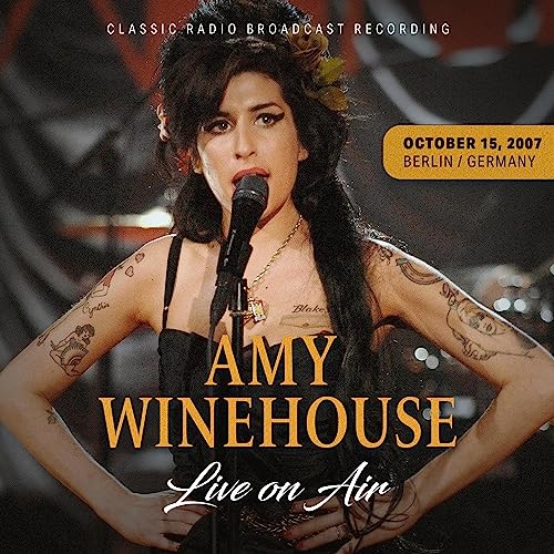 Amy Winehouse singing into a microphone on CD cover art.