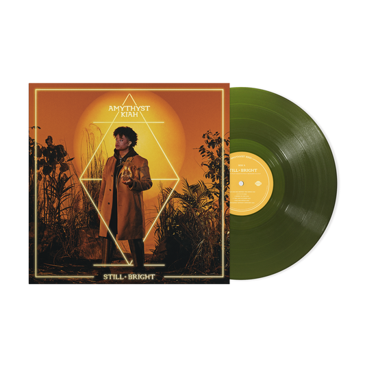 Amythyst Kiah album cover art and a forest green vinyl record on black background.