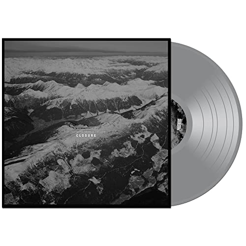 Vinyl record with snowy mountain range album art, grayscale image.