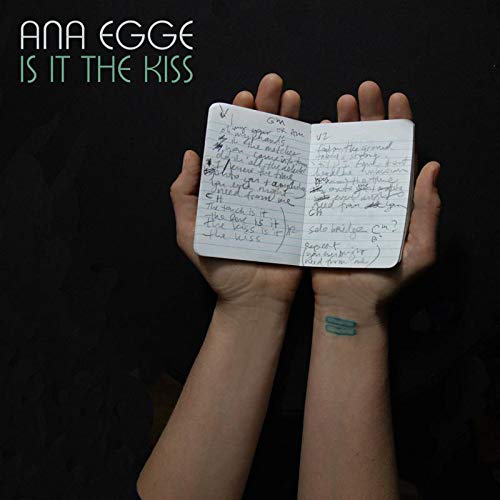 Ana Egge's album cover featuring hands holding a notebook with handwritten lyrics.
